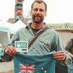 Photo courtesy Sequim Farmers & Artisans Market/ Market guest Tracy proudly shows off their re-usable bag and re-usable bag voucher, an initiative with BrokersGroup Real Estate that saves waste and keeps funds in the local economy.