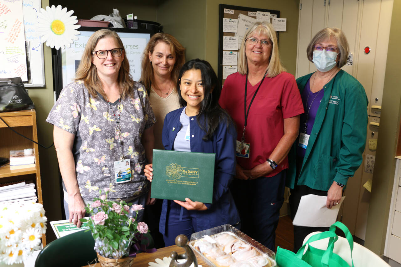 Photo courtesy of Olympic Medical Center
Registered nurse Rosie Dehoyos, center, receives her DAISY Award for Extraordinary Nurses honor. Here she is pictured with (from left): Denise Harman, director of medical/surgical/pediatrics; Chief Nursing Officer Vickie Swanson; and registered nurses Renee Somerfeld, and Janeen Howell.