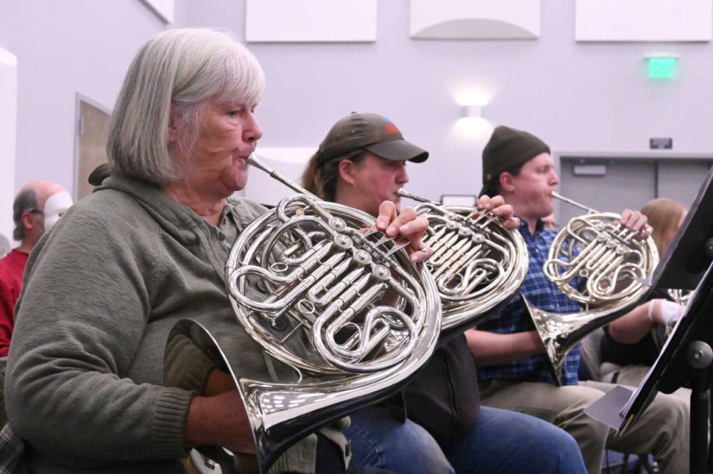 Sequim Gazette photo by Michael Dashiell / From left, Kathy Brown, Natalie Brown and David Blackmon practice a tune at the Sequim City Bands rehearsal on Oct. 25.