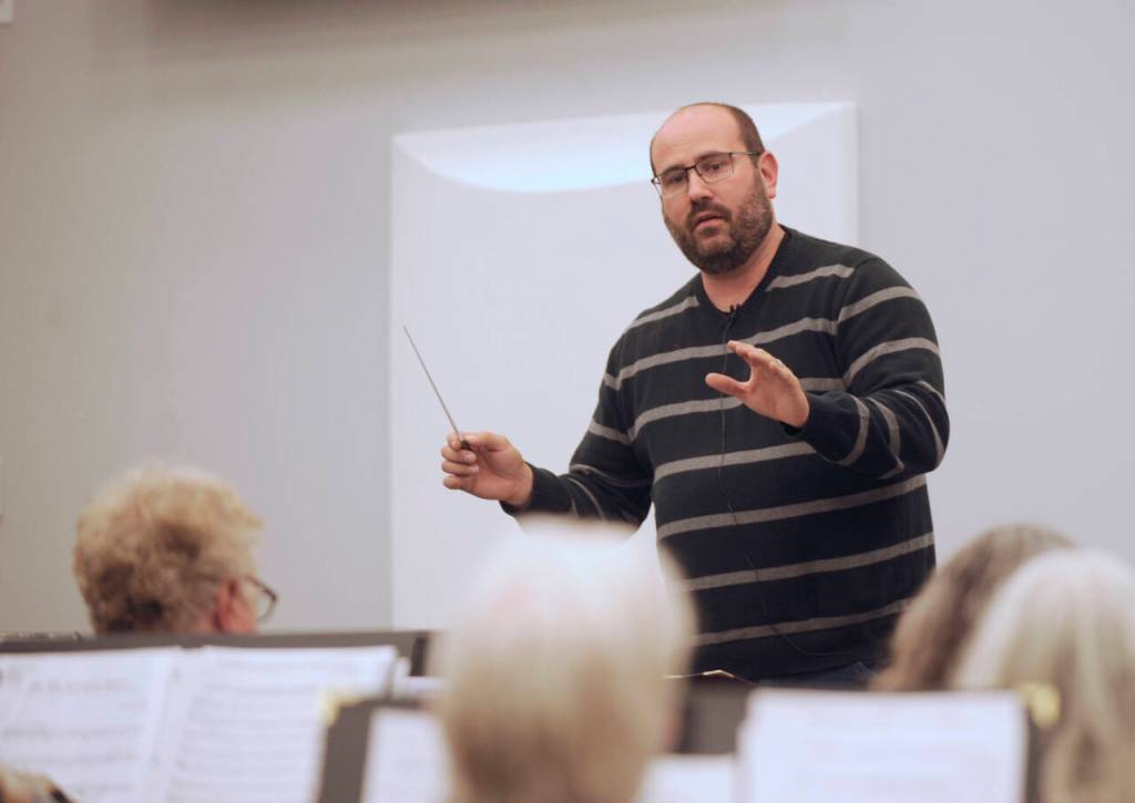 Sequim Gazette photo by Michael Dashiell / Sequim City Band director Tyler Benedict leads the group in an Oct. 25 rehearsal.