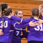 Sequim Gazette photo by Michael Dashiell / Sequims Sydney Clark (7) and other SHS players celebrate a point in the third set of a three-set sweep of Bremerton in Oct. 24.