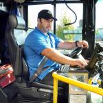 Clallam Transit driver Dante Ruiz prepares his bus for the 30 Route to Sequim on Wednesday at The Gateway transit center in Port Angeles. (Keith Thorpe/Peninsula Daily News)