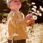 Photo courtesy of Teresa Smith
Isaac Smith, pictured here picking flowers in a family photo, loved nature and in particular eagles and all sorts of birds found across Sequim, his mother Teresa Smith said. She helped fundraise for sets of binoculars now available at the Dungeness River Nature Center that pay tribute to her son.
