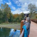 Photo courtesy of Teresa Smith
A visitor to the Dungeness River Nature Center uses binoculars donated by the family of Isaac Smith that bears on its strap a patch that honors the memory of the Sequim youth.