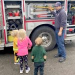 Photo courtesy Clallam County Fire District 3
Firefighter/EMT Jon Donahue shows some preschoolers the tools on a fire engine during a recent fire station tour. Check out ambulances, fire trucks, fire hoses and more at the Public Safety and Information Fair on Nov. 4 in Carrie Blake Community Park.