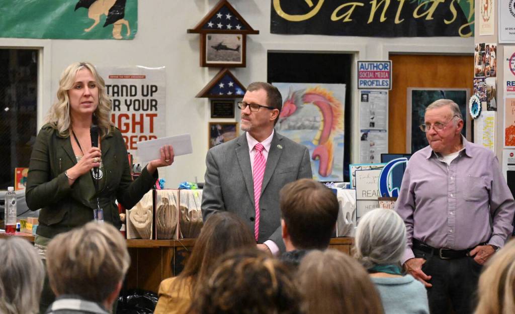 Sequim Gazette photo by Michael Dashiell / Kimberly Burns, Court Services Manage with Clallam County Juvenile and Family Services thanks Albert Haller Foundation board member Marty Brewer, center, and foundation president Gary Smith at an awards ceremony held Oct. 24 in Sequim.