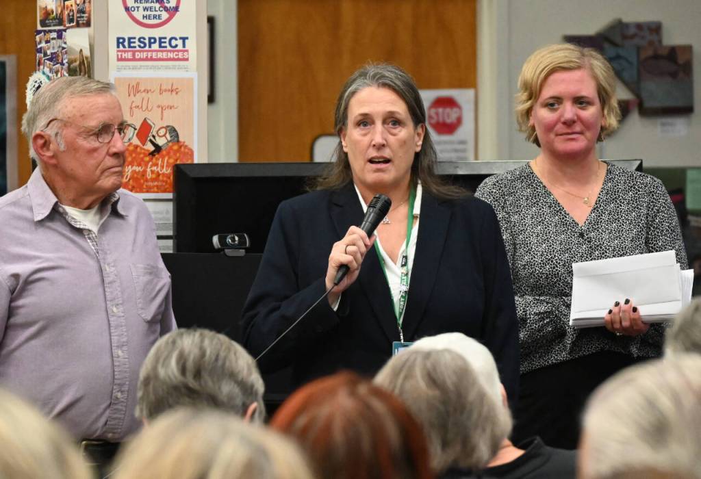 Sequim Gazette photo by Michael Dashiell / Michelle Gentry, Port Angeles School District Americorps program coordinator, thanks board president Gary Smith and board member Michelle Olsen of the Albert Haller Foundation for a grant award at an Oct. 24 ceremony in Sequim.