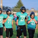 Photo courtesy of Sequim Middle School football / Sequim Middle School players (from left) Kaden Miller, Dalton Attwood, Samuel Thompson, Timothy Sealey and Max Sivilli get a breather during a break in play during a 2023 league contest.