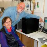 Sequim Gazette file photo by Patricia Morrison Coate/ Back in 2016, Tom LaMure and Kelly McKillip observe the first step in the process: wiping the hard drive clean of donated computers with the Sequim PC Users Group.
