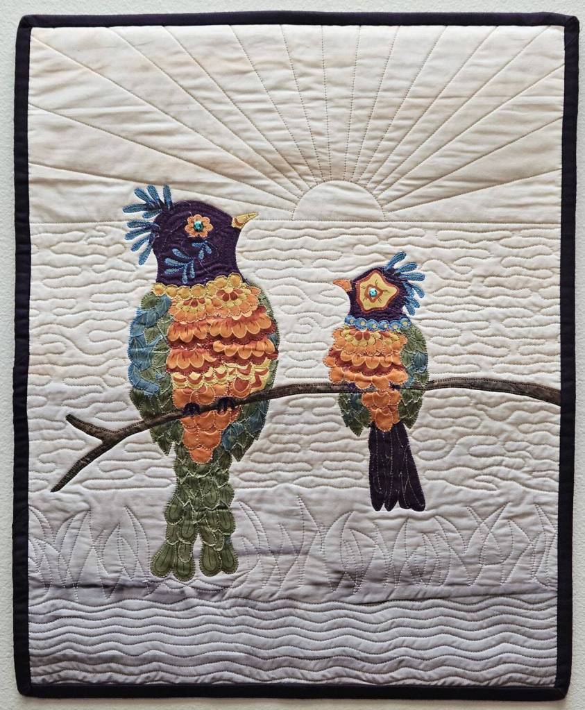 Artwork courtesy of Lynn Gilles
New Day 2 by Lynn Gilles, a featured artist in the18th-annual North Olympic Fiber Arts Festivals fiber arts exhibition, Spinning Sewn Stories – Promulgate, Piece, & Ply.