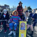 Horror icons, from left, Jigsaw (Ryan Blackburn), Chucky (Jason Schleve), Freddy Krueger (Ashley Blackburn), Tiffany (Kylie Blackburn), and Michael Myers (Ryan Blackburn) join in on the trunk-or-treat fun on Oct. 28 with the Olympic Peninsula Rat Racers at the Sequim Village Shopping Center.