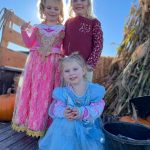 From top left, Kacy Batson, 4, Daisy Mae Forsyth, 5, and Dixie Forsyth, 2, in front, join in on the trunk-or-treat fun on Oct. 28 at the Sequim Village Shopping Center.