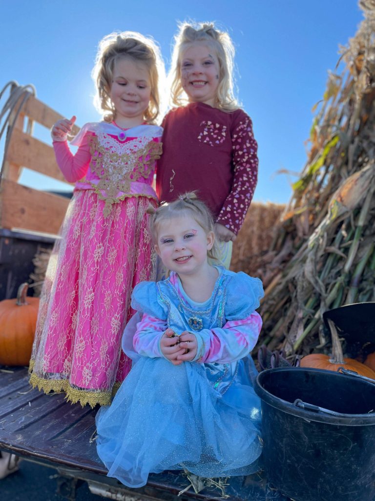 From top left, Kacy Batson, 4, Daisy Mae Forsyth, 5, and Dixie Forsyth, 2, in front, join in on the trunk-or-treat fun on Oct. 28 at the Sequim Village Shopping Center.