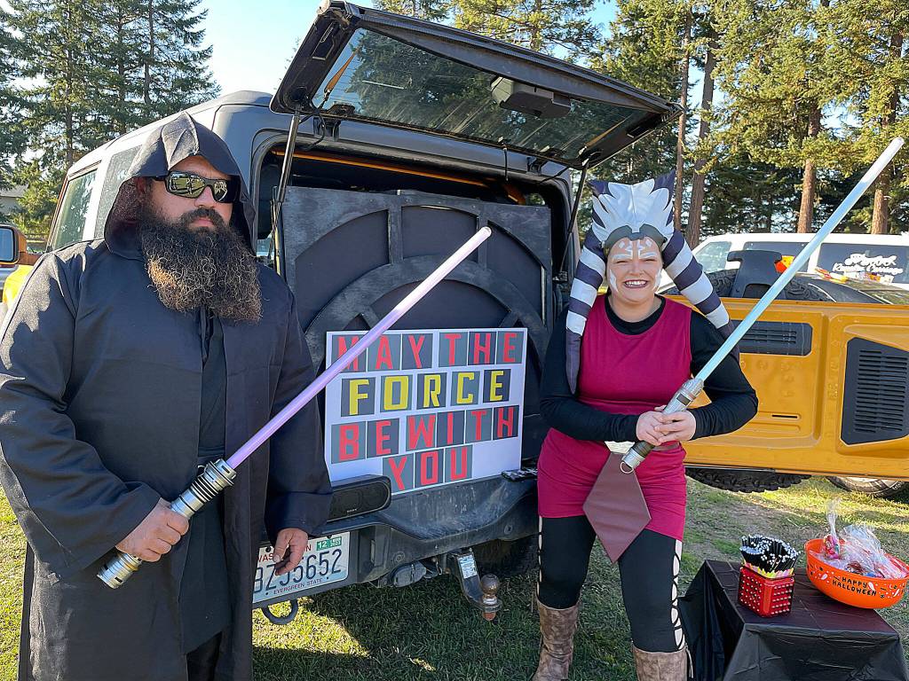 Sequim Gazette photo by Matthew Nash/ Skyler and Torrie Lewis join the Star Wars universe for the Sequim Prairie Granges trunk-or-treat event on Oct. 28.