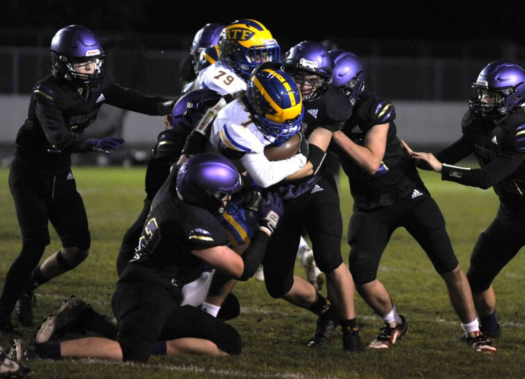 Sequim Gazette photo by Michael Dashiell / Sequim defenders gang up to tackle Fife running back Anthony Duran in the first half of a non-league contest in Sequim on Nov. 3.