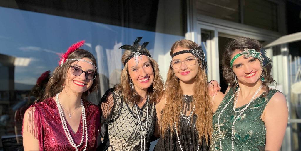 Sequim Gazette photo by Matthew Nash/ Flappers, from left, Alyssa Shepherd, Ashley Possin, Annaliece Possin and Alexis Shepherd hand out candy in front of Cedarbrook Lavender on Halloween. It was their second year in a group costume, Alyssa said.