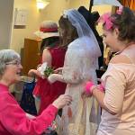 Sequim Gazette photo by Matthew Nash/ Olivia Knight dressed in 1980s attire goes trick-or-treating inside the Fifth Avenue on Halloween.