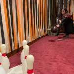 Sequim Gazette photo by Matthew Nash/ Inside the Fifth Avenues bat cave, Allison Washburn, 6, bowls as Harry Potter while Avery Anasasi, 6, as Belle waits her turn on Halloween night.