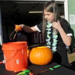 Keith Thorpe/Olympic Peninsula News Group/ Daria ONeill, 9, of Sequim empties the innards of a pumpkin at Sequim Prairie Grange Fall Festival & Trunk or Treat on Saturday at the grange hall and grounds near Carlsborg. The festival featured pumpkin carving, childrens games and treats handed out to costumed youngsters.
