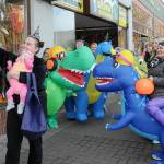 Keith Thorpe/Olympic Peninsula News Group/ Jessica Jackson of Joyce, and her son, Blakely Baker, 5 months, poses for a selfie with a herd of inflatable dinosaurs ridden by employees of Port Angeles-based Eleven Eleven Dental during Tuesdays Halloween trick-or-treating in downtown Port Angeles. Riders, were, from left, Erica Ostteen, Taylor Peabody, Krystal Feris, Emma Lindberg, Kelly Wheeleer and Alexis Perry.
