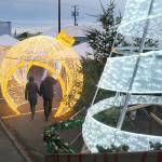 KEITH THORPE/PENINSULA DAILY NEWS
Visitor to the Port Angeles Winter Ice Village walk through a decorative ornament, part of a donation of holiday decorations from the Microsoft Corporation to the Olympic Medical Center Foundation for use at last weekend's Festival of Trees, and then moved to the ice village for the duration of the ice skating season. The villages offers daily skating through Jan. 2 in downtown Port Angeles.
