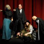 Sequim Gazette photo by Michael Dashiell / Fellow actors look for the assailant following a play-within-a-play Olympic Theatre Arts The Games Afoot or Holmes for the Holidays. Veteran stage actor William Gillette (portrayed by Joel Hoffman) is gunned down, and fellow thespians Madge Geisel (Cheryl Tamblyn), Felix Geisel (Steve Rodeman), Aggie Wheeler (Merrin Packer) and Simon Bright (Stephan Willms) come to his aid.