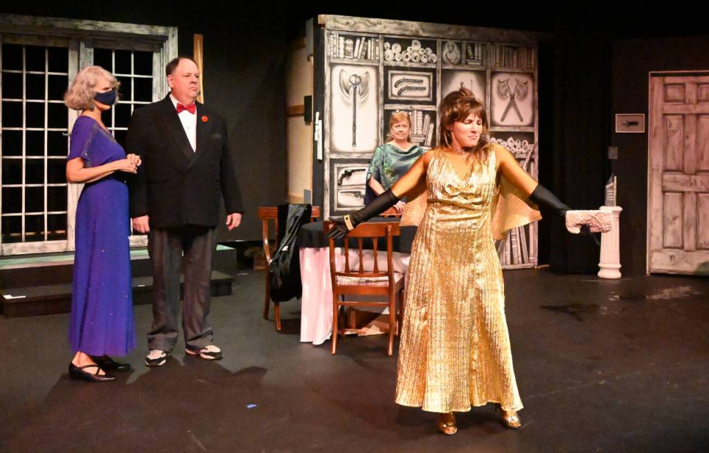 Sequim Gazette photoS by Michael Dashiell
Jamie Pauley portrays Daria Chase, an antagonistic Vanity Fair columnist, in an early scene of The Games Afoot or Holmes for the Holidays. Looking on are, from left, Madge Geisel (Cheryl Tamblyn), Felix Geisel (Steve Rodeman) and Martha Gillette (Cheryl DiPietro).