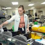 Photo by Keith Thorpe/Olympic Peninsula News Group
Clallam County election worker Savannah Wise of Port Angeles collects sorted general election ballots for counting at the Clallam County Courthouse in Port Angeles on Nov. 7.