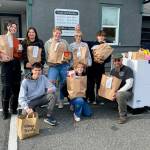 Photo courtesy of Heidi Krzyworz
Students continued the annual Boo Hunger food campaign this October. Some participants included, from top left, Emily Post, Melia Nelson, Skylar Krzyworz, Kimberly Heintz, Weston Owens; and from front left, Zachary Post, Kaitlyn Carpenter, and Andrew Zeppa, Sequim Food Bank warehouse manager.