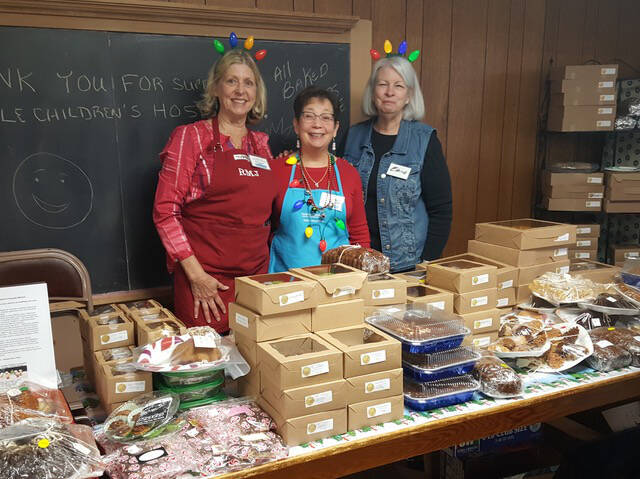 Photo courtesy of Sequim Guild of Seattle Childrens Hospital
Robbie Justyn, Renee Jones and Elaine OBrien oversee baked good items in The Guild Room at a previous Holiday Bazaar hosted by the Sequim Guild of Seattle Childrens Hospital. This years event is set for Nov. 18.