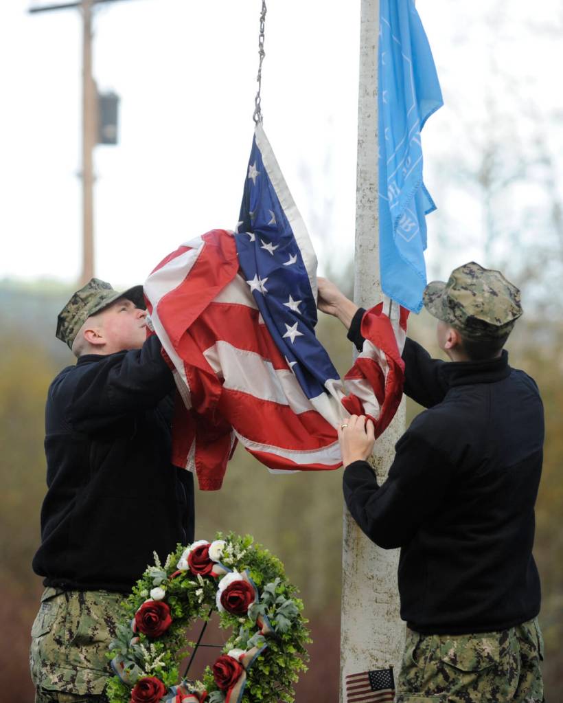 Sequim Gazette photo by Michael Dashiell / The community honors Medal of Honor recipient construction mechanic third class Marvin G. Shields, at Gardiner Community Cemetery on Nov. 11. Shields is the only Navy Seabee to have received the Medal of Honor. He was posthumously awarded the Medal of Honor for heroism above and beyond the call of duty in the Vietnam War. A native of Gardiner, Shields was buried with a Marine Corps honor guard at the Gardiner Cemetery on June 19, 1965.