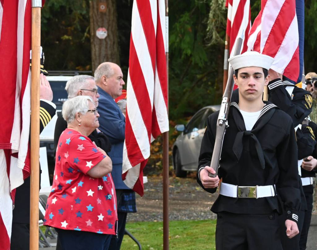 Sequim Gazette photo by Michael Dashiell / The community honors Medal of Honor recipient construction mechanic third class Marvin G. Shields, at Gardiner Community Cemetery on Nov. 11. Shields is the only Navy Seabee to have received the Medal of Honor. He was posthumously awarded the Medal of Honor for heroism above and beyond the call of duty in the Vietnam War. A native of Gardiner, Shields was buried with a Marine Corps honor guard at the Gardiner Cemetery on June 19, 1965.