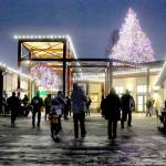 Photo by Keith Thorpe/Olympic Peninsula News Group / The Dungeness River Nature Center stands illuminated by Christmas lights as visitors roam the outdoor patio after a lighting ceremony for the center and nearby Railroad Bridge on Nov. 16 night in Sequim. Hundreds of people took part in the event, which featured holiday songs by the Sequim High School Choir on the historic bridge over the Dungeness River.