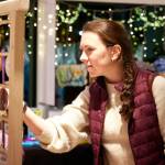 Photo courtesy of Port Angeles Fine Arts Center
A shopper enjoys the Port Angeles Fine Arts Centers Makers Market in 2022. This years market opens Nov. 24 and runs through Dec. 17.