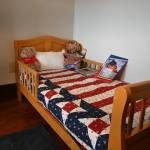Sequim Gazette photo by Michael Dashiell / A look inside Captain Joseph House, a bed-and-breakfast turned respite home in Port Angeles for Gold Star families. This room features a childs bed with a stuffed animal clothed in a quilt made by the Sunbonnet Sue Quilt Club of Sequim.
