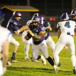 Sequim Gazette photo by Michael Dashiell / Sequim's Liam Wiker, center, finds a gaping hole in the North Mason defense in the second half of Sequim's 36-0 win on Oct. 13. Wiker led the team with 106 yards on 14 carries.
