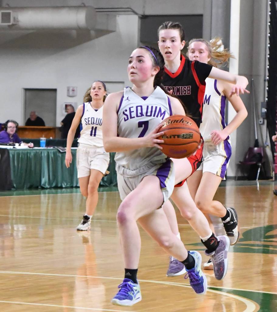 Photo by Jim Heintz / Sequims Hannah Bates leads a fastbreak in the first half of SHSs 57-37 win over Sammamish at the class 2A state tournament in Yakima in March. Bates joins SHS teammate Jelissa Julmist on the Peninsula Pirates squad this winter.