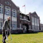 File photos by Keith Thorpe/Olympic Peninsula News Group 
David Brownell, executive director of the North Olympic History Center, stands in front of the historic Lincoln School at Eighth and C streets in Port Angeles in April. The center had hoped to divest itself of the school building and issued a request for proposal on what to do with the structure, but after receiving no feasible offers its board decided in late November to demolish the structure.