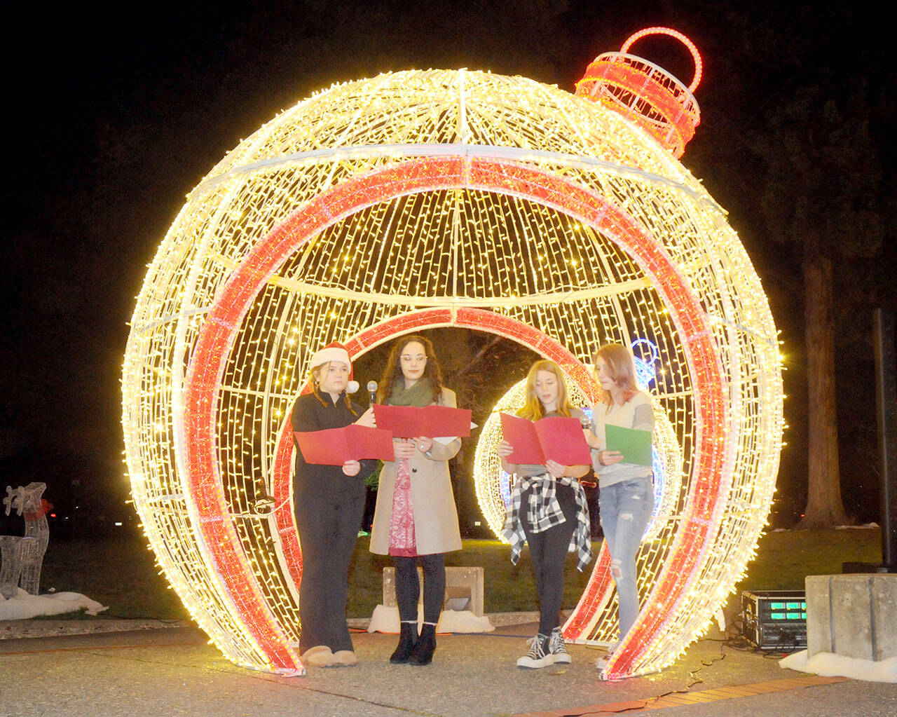 Photo by Keith Thorpe/Olympic Peninsula News Group
Singers, from left, Abbigail Cuellar, 16, Danielle Lorentzen of Ghostlight Productions, Kaylyn Stroup, 15, and Max MacFall, 15, perform a Christmas carol during the opening ceremony for the 33rd annual Festival of Trees at Vern Burton Community Center in Port Angeles on Nov. 22.