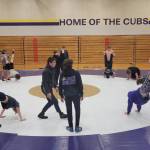 Sequim Gazette photoS by Michael Dashiell
Sequim High wrestlers do some modified pushups at a preseason practice at the SHS auxiliary/Olympic Peninsula Academy gymnasium last week.