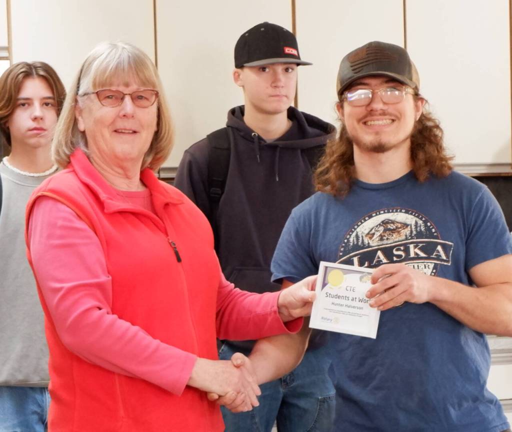 Photo courtesy of Sequim School District / Kathy Strozyk of Sequim Sunrise Rotary hands Sequim high School student Hunter Halverson