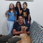 Photo courtesy of Kyle Johnson / The Johnson family  pictured are, from left, Josephine, Charlotte and Collin with dad Kyle with their new dog, Binti and (not pictured) mom Anna  adjusts to life in Africa.