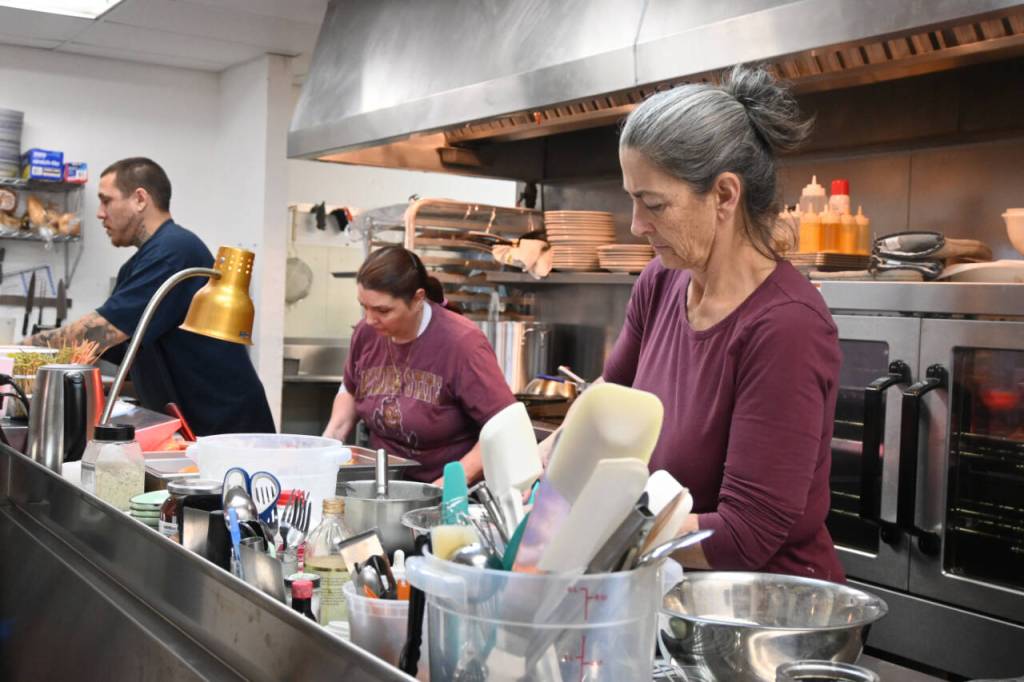 Sequim Gazette photo by Michael Dashiell / Riverhouse Bakery & Café owner Denise Ferguson, right, and staffers Brandon Spivey and Maria Flores prepare food for the lunchtime crowd last week.