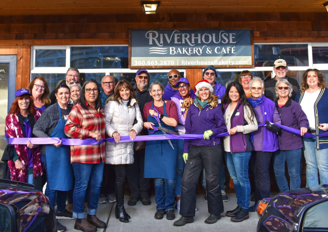 Photo by Monica Berkseth of Time Catcher Photography
Riverhouse Bakery & Café owner Denise Ferguson (center) celebrates a ribbon-cutting at the newly-opened eatery with members of the Sequim-Dungeness Chamber of Commerce.