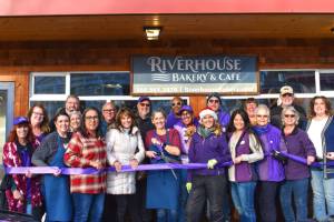 Photo by Monica Berkseth of Time Catcher Photography
Riverhouse Bakery & Café owner Denise Ferguson (center) celebrates a ribbon-cutting at the newly-opened eatery with members of the Sequim-Dungeness Chamber of Commerce.