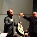 Photo by Diane Urbani de la Paz
Guitarist Colin Davin, left, stands beside Port Angeles Symphony conductor Jonathan Pasternack, immediately after stepping in at the last minute to perform with the orchestra in December 2021. Davin will rejoin the Symphony for its Holiday Concert this Saturday.