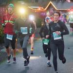 Photo by Run the Peninsula
Sequims Laura Gould, right, races to a second place finish (and seventh overall) in the Jamestown Glow Run on Dec. 2. Also pictured are, from left, Brenth Unruh of Maple Valley, Andrew Gorbett of Forks and G. Moon of Seabeck.