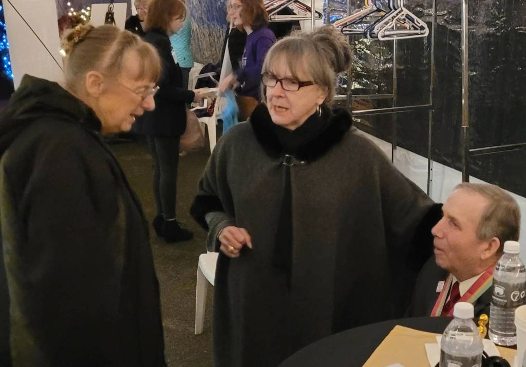 Sequim Gazette photo by Michael Dashiell / At left, Judy Willman, daughter of Olympic Games gold medal winner Joe Rantz, talks with Matthew Dryke, Olympic Games 1984 gold medal winner, and Judy Reandeau Stipe, volunteer executive director of Sequim Museum & Arts, at the A Tribute to Joe Rantz gala on Dec. 8.