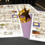 Special-made placemats showing historical pictures of Joe Rantz and the University of Washington rowing team sit on a table during a fundraising gala for the Joe Rantz Rotary Youth Fund at the Sequim Museum & Arts on Dec. 8.