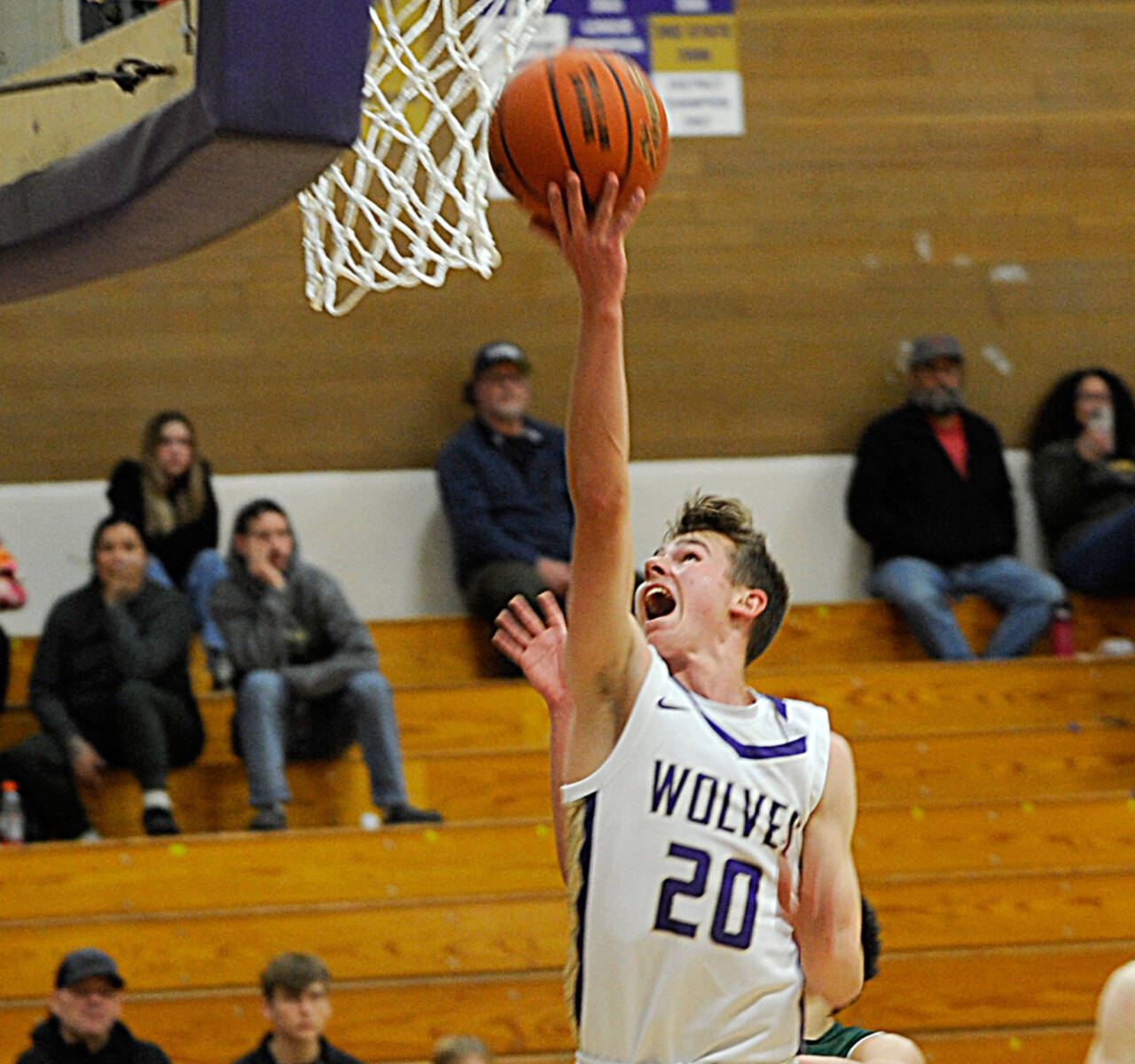 Sequim Gazette photo by Matthew Nash
Sequim freshman Mason Rapelje goes up for a reverse layup against the Vashon Island Pirates on Dec. 9. Sequims varsity basketball squad won 84-44.